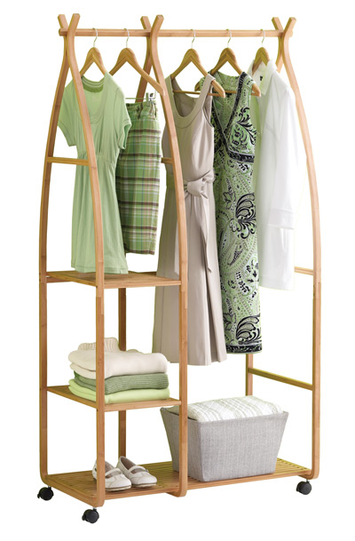 A moveable garment rack offers compact storage without inviting clutter as dressers do. This bamboo version from The Container Store costs $130.